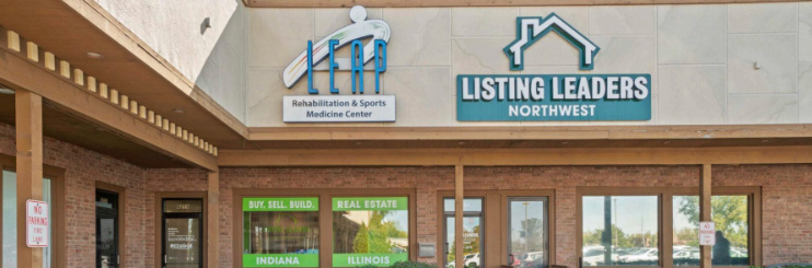 Exterior view of Listing Leaders Northwest real estate school building entrance next to LEAP Rehabilitation Center.
